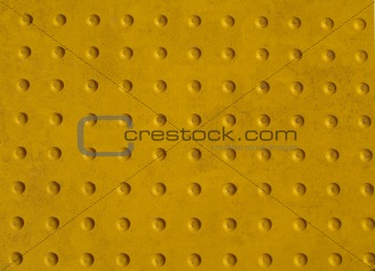 Grunge Yellow Texture of a Non-slip Pattern on a Sidewalk