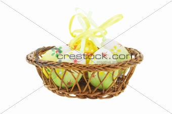 Decorative Easter eggs in basket 