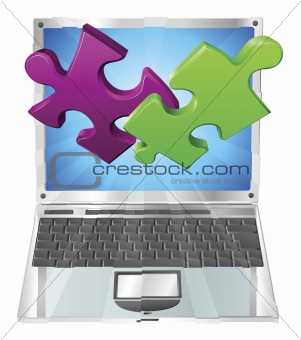 Jigsaw puzzle pieces flying out of laptop computer