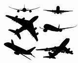 black silhouettes of passenger aircraft
