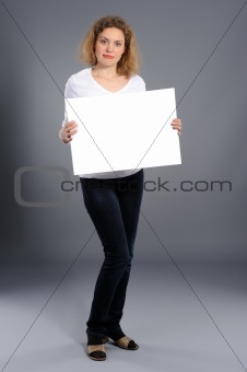 woman holding empty white board
