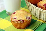 muffins with berries and a glass of milk