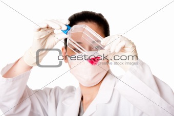 Female scientist looking at tissue culture flask
