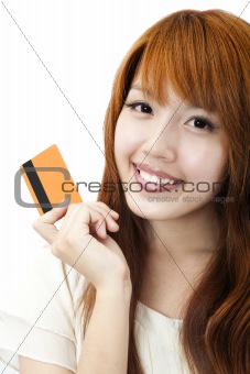 Portrait of the beautiful happy girl  holding  a credit card for shopping