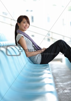 sporty girl sit in sport arena