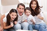 Happy Family Having Fun Playing Video Console Games