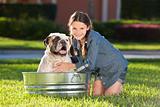 Pretty Young Girl Washing Her Pet Dog In A Tub