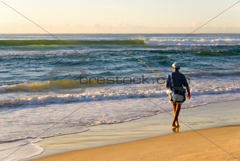 Beach Fisherman by Ocean as Sun rises