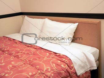 double bed with two pillows