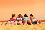 Four girls at orange sea