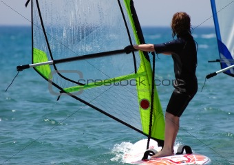 kid windsurfer