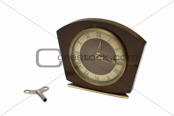 Wooden clock and winder isolated