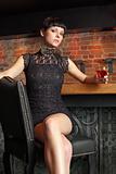 Sexy female sitting in a bar