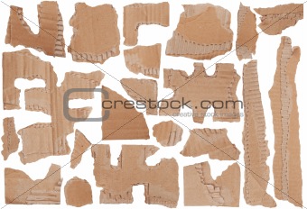 Pieces of torn brown corrugated cardboard