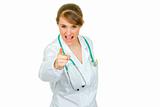 Evil medical doctor woman shaking her finger
