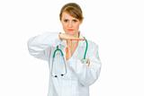 Concentrated medical doctor woman with time out crossed arms
