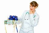 Surprised medical doctor woman holding present in hand 
