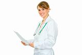 Smiling  medical doctor woman holding document in hands
