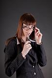 Thoughtful business woman wearing glasses 