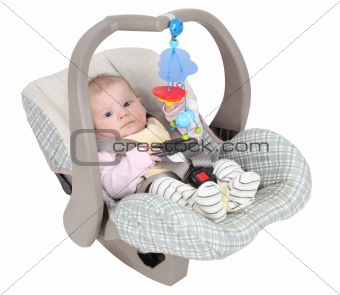 Baby in child car seat isolated over white background