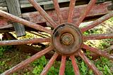 Old weathered red wagon wheel
