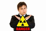 radiation danger! Confident businessman with crossed arms
