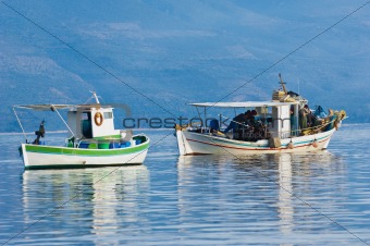 Two fishing boats in a southern Greece bay