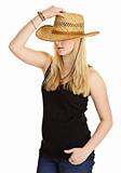 Young pale girl in old-fashioned straw hat