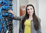 woman it engineer in network server room