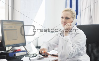 pharmacy worker talking by phone