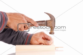 Hands Getting Ready to Hammer in a Nail