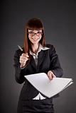 Cheerful businesswoman with documents and pen 