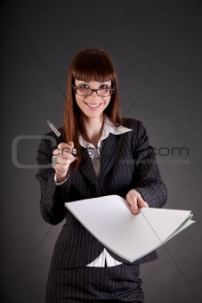 Cheerful businesswoman with documents and pen 