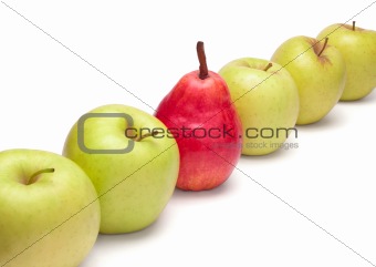 Ripe red pear and green apples in diagonal