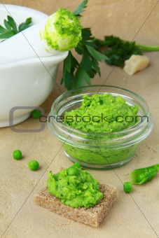 pate with green peas on a piece of bread