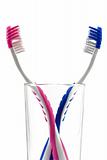 two toothbrushes in glass isolated