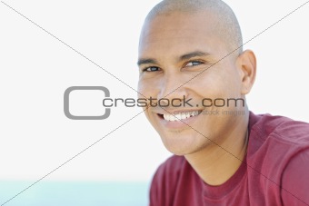young latino man smiling at camera