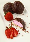 cookies with marshmallows and chocolate on a white plate with strawberries