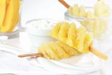 Pineapple skewer with curd cheese