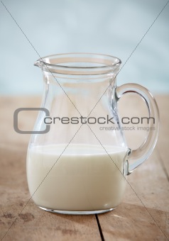 closeup of milk on old wooden table