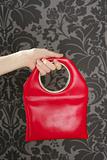 handbag retro vintage fashion red bag on gray wallpaper