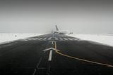 airplane wing aircraft landing in snow winter runway
