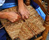 enea traditional spain reed chair handcraft man hands working