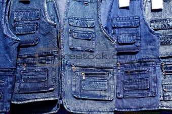 Denim blue jeans vest rows in a retail shop