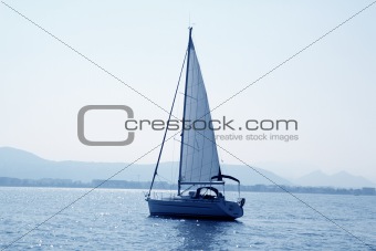 sailboat sailing in blue mediterranean sea