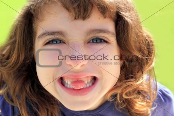 indented girl sticking tongue between teeth