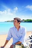 beach vacation man looking the sea blue shirt