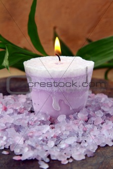 purple candle and sea salt spa concept