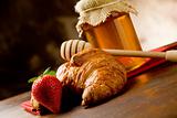 Croissants with honey and strawberries