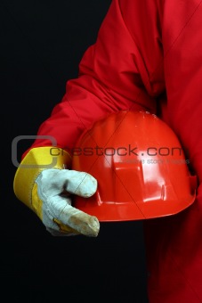 man holding red helmet 